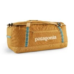 Patagonia Black Hole Duffel 70L - 100% Postconsumer Recycled Polyester -Sportswear Shop black hole duffel 70l 100 postconsumer recycled polyester bags patagonia puffer gold 535146